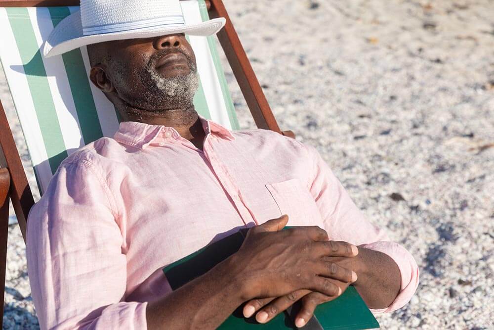 Man relaxing in the sun on the beach